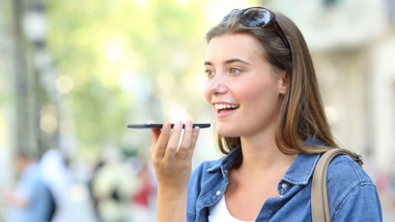 Girl-Talking-Into-Phone-Voice-Search-Hot-Dog-Marketing